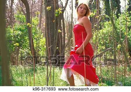 Stock Image - Dressed up Walking in Woods. Fotosearch