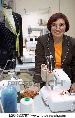 Dressmaking workshop, clothes arrangements. Retail. Elgoibar, Gipuzkoa, Euskadi. Spain. View Large Photo Image Stock Photo - Dressmaking workshop, clothes arrangements. Retail. Elgoibar, Gipuzkoa, Euskadi. Spain.. Fotosearch