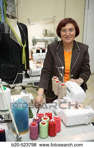 Dressmaking workshop, clothes arrangements. Retail. Elgoibar, Gipuzkoa, Euskadi. Spain. View Large Photo Image Stock Photo - Dressmaking workshop, clothes arrangements. Retail. Elgoibar, Gipuzkoa, Euskadi. Spain.. Fotosearch