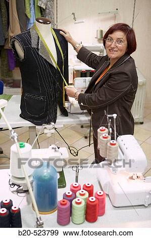 Dressmaking workshop, clothes arrangements. Retail. Elgoibar, Gipuzkoa, Euskadi. Spain. View Large Photo Image Stock Photo - Dressmaking workshop, clothes arrangements. Retail. Elgoibar, Gipuzkoa, Euskadi. Spain.. Fotosearch