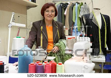 Dressmaking workshop, clothes arrangements. Retail. Elgoibar, Gipuzkoa, Euskadi. Spain. View Large Photo Image Stock Photograph - Dressmaking workshop, clothes arrangements. Retail. Elgoibar, Gipuzkoa, Euskadi. Spain.. Fotosearch
