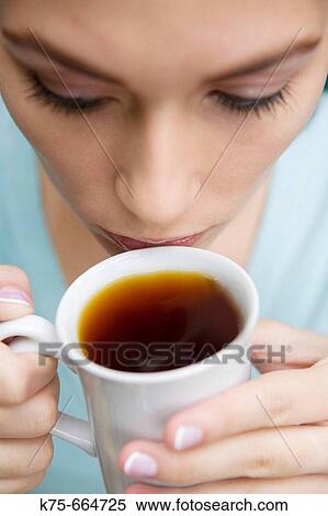 Stock Photography - Drinking a cup of tea. Fotosearch