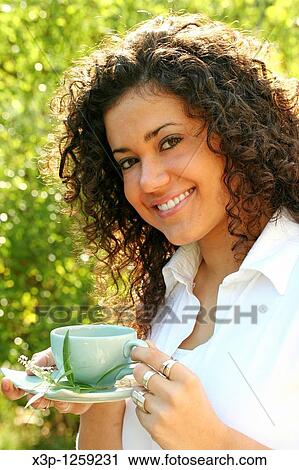 Drinking an infusion View Large Photo Image Stock Image - Drinking an infusion. Fotosearch