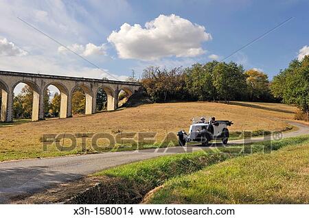 drive with an open touring vintage car Renault 1925 around Auch Gers department, Midi-Pyrenees, southwest of France, Europe View Large Photo Image Picture - drive with an open touring vintage car Renault 1925 around Auch Gers department, Midi-Pyrenees, southwest of France, Europe. Fotosearch