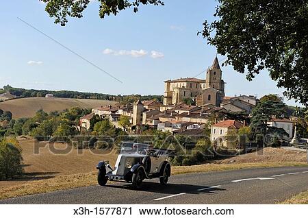 Drive with an open touring vintage car Renault of 1925 around Lavardens, Gers department, Midi-Pyrenees, southwest of France, Europe View Large Photo Image Stock Image - Drive with an open touring vintage car Renault of 1925 around Lavardens, Gers department, Midi-Pyrenees, southwest of France, Europe. Fotosearch