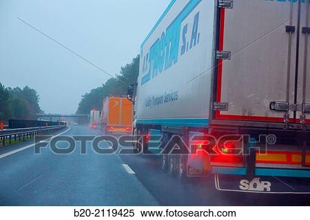 Driving a truck in bad weather on the highway. Rain. near Bordeaux. Aquitaine. France. View Large Photo Image Stock Photography - Driving a truck in bad weather on the highway. Rain. near Bordeaux. Aquitaine. France.. Fotosearch
