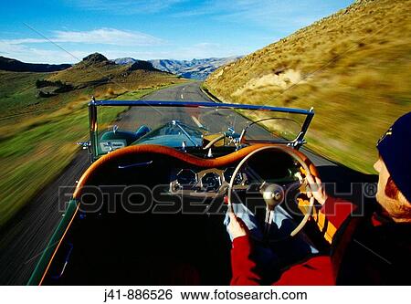 Stock Photograph - Driving along the Summit Road Port Hills Christchurch New Zealand. Fotosearch