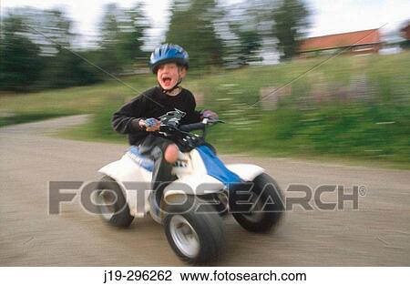 Driving four-wheeler terrain car for children View Large Photo Image Stock Image - Driving four-wheeler terrain car for children. Fotosearch