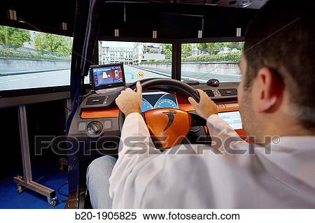 Driving Simulator Test Validation of eco-driving systems, platooning systems road trains, driver behavior to different types of situations acoustic, visual or vibro-tactile View Large Photo Image Stock Photography - Driving Simulator Test Validation of eco-driving systems, platooning systems road trains, driver behavior to different types of situations acoustic, visual or vibro-tactile. Fotosearch