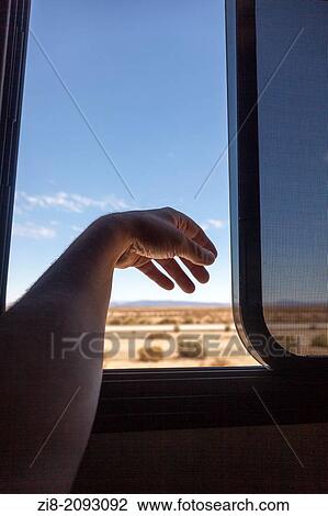 Stock Image - Driving through Mojave desert, California, USA. Fotosearch