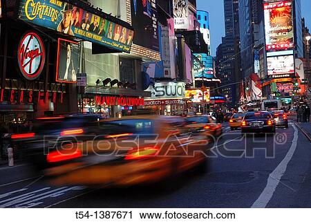 Driving yellow Cabs in the Evening at Time Square in New York View Large Photo Image Stock Image - Driving yellow Cabs in the Evening at Time Square in New York. Fotosearch