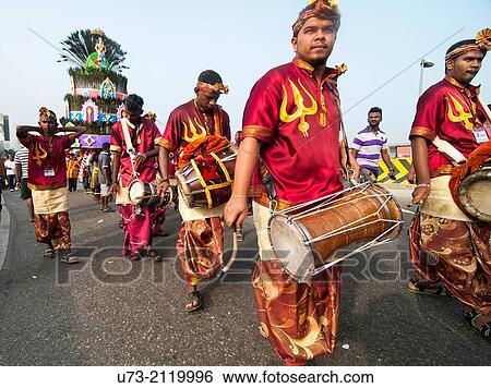 Stock Photograph - Drummers & percussion players leading a procession during the Thaipusam festival in KL, Malaysia. Fotosearch
