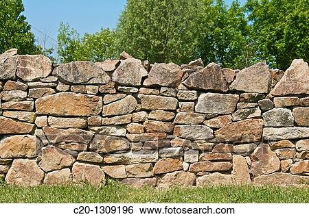 dry stones wall to separate fields typical of Brittany France View Large Photo Image Stock Photograph - dry stones wall to separate fields typical of Brittany France. Fotosearch