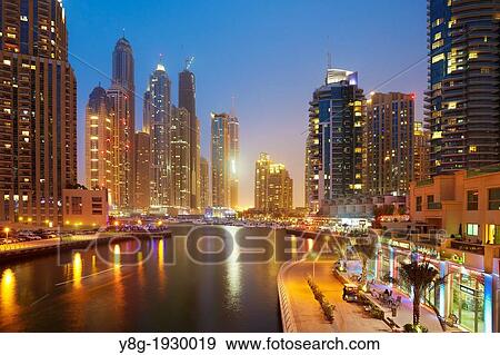Stock Photo - Dubai Marina at evening, modern skyscrapers on the canal, Dubai, United Arab Emirates. Fotosearch
