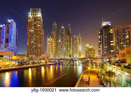 Dubai Marina by night, modern skyscrapers on the canal, Dubai, United Arab Emirates View Large Photo Image Stock Image - Dubai Marina by night, modern skyscrapers on the canal, Dubai, United Arab Emirates. Fotosearch