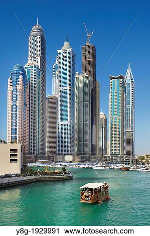 Dubai Marina, view to Yacht harbor and Princess Tower, the highiest residential building in the world, Dubai, United Arab Emirates View Large Photo Image Stock Image - Dubai Marina, view to Yacht harbor and Princess Tower, the highiest residential building in the world, Dubai, United Arab Emirates. Fotosearch