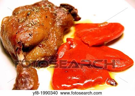 Duck confit, Roasted duck leg with red piquillo peppers. View Large Photo Image Stock Image - Duck confit, Roasted duck leg with red piquillo peppers.. Fotosearch