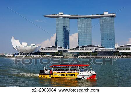 Duck Tours boat with Marina Bay Sands Hotel at the background, Singapore. View Large Photo Image Picture - Duck Tours boat with Marina Bay Sands Hotel at the background, Singapore.. Fotosearch