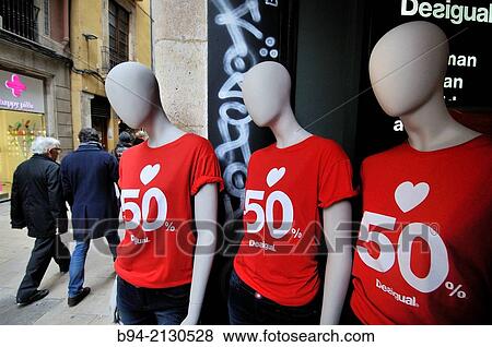Dummies indicating discount in clothing store. Barcelona. Catalonia. Spain. View Large Photo Image Stock Photo - Dummies indicating discount in clothing store. Barcelona. Catalonia. Spain.. Fotosearch
