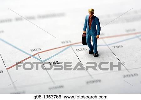 Dummies on a graph of stock market. View Large Photo Image Stock Photograph - Dummies on a graph of stock market.. Fotosearch