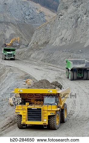 Dumper-trucks to carry marl from quarry to cement plant View Large Photo Image Stock Image - Dumper-trucks to carry marl from quarry to cement plant. Fotosearch