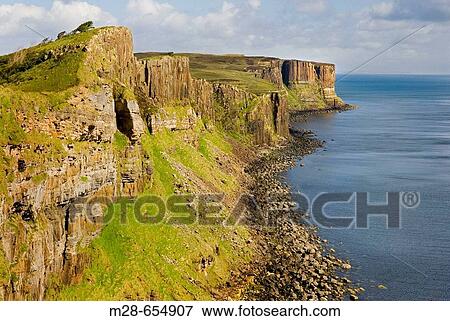Dunite cliffs on the coast of Isle of Skye Scotland, Kilt Rock is in the distance. View Large Photo Image Stock Photo - Dunite cliffs on the coast of Isle of Skye Scotland, Kilt Rock is in the distance.. Fotosearch