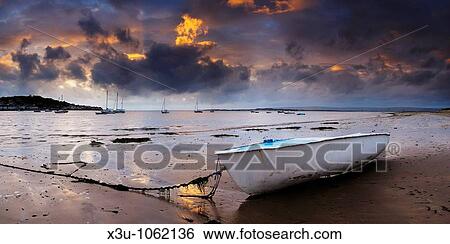 Dusk light over Appledore and the Torridge and Taw estuary viewed from the beach at Instow in Devon, United Kingdom View Large Photo Image Stock Photograph - Dusk light over Appledore and the Torridge and Taw estuary viewed from the beach at Instow in Devon, United Kingdom. Fotosearch
