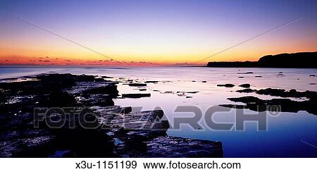 Dusk over Kimmeridge Bay on the Dorset Jurassic Coast, Kimmeridge, Dorset, England, United Kingdom View Large Photo Image Stock Photo - Dusk over Kimmeridge Bay on the Dorset Jurassic Coast, Kimmeridge, Dorset, England, United Kingdom. Fotosearch