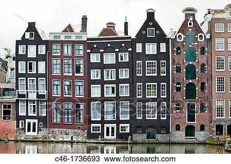 Stock Image - Dutch houses, Canal, Amsterdam, Netherlands.. Fotosearch