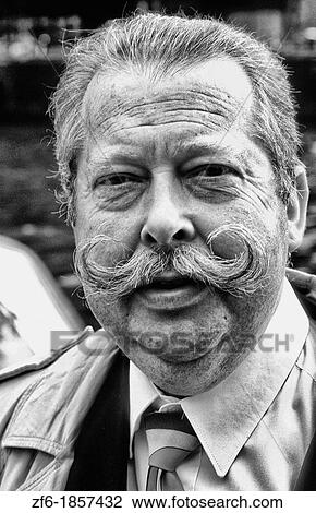 Dutch man with handlebar mustache in Amsterdam Holland Netherland View Large Photo Image Stock Image - Dutch man with handlebar mustache in Amsterdam Holland Netherland. Fotosearch