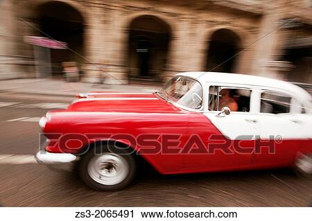 Dynamic scene of an old american car, Prado, Havana, Cuba, West Indies, Central America. View Large Photo Image Stock Image - Dynamic scene of an old american car, Prado, Havana, Cuba, West Indies, Central America.. Fotosearch