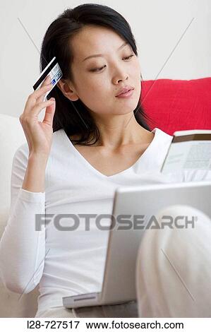 E-commerce, woman shopping at home with credit card View Large Photo Image Stock Photo - E-commerce, woman shopping at home with credit card. Fotosearch