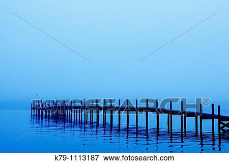 Early morning fog surrounds a dock. View Large Photo Image Stock Photo - Early morning fog surrounds a dock.. Fotosearch