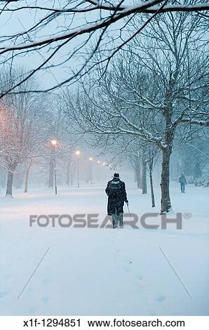 Early morning, people walking in the snow, Aberystwyth, Wales, UK, december. View Large Photo Image Stock Image - Early morning, people walking in the snow, Aberystwyth, Wales, UK, december.. Fotosearch
