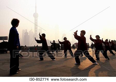 Early morning tai chi exercises on the Bund, Shanghai, China View Large Photo Image Picture - Early morning tai chi exercises on the Bund, Shanghai, China. Fotosearch