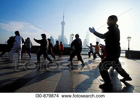 Early morning tai chi exercises on the Bund, Shanghai, China View Large Photo Image Picture - Early morning tai chi exercises on the Bund, Shanghai, China. Fotosearch