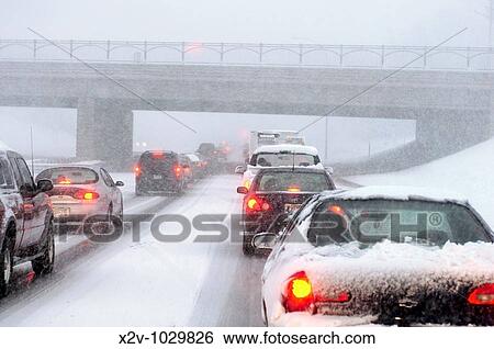Early spring snow storm stalls the morning commute in Minneapolis, Minnesota View Large Photo Image Stock Photograph - Early spring snow storm stalls the morning commute in Minneapolis, Minnesota. Fotosearch