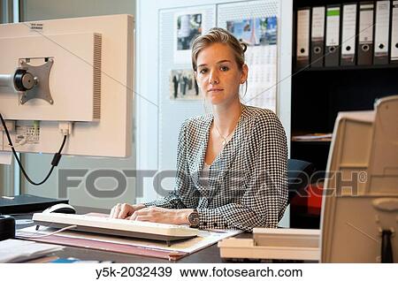 East-Berlin, Berlin, Germany. Young woman, working as a secretary at the office, supporting the vice-president of the cooperation. View Large Photo Image Stock Photo - East-Berlin, Berlin, Germany. Young woman, working as a secretary at the office, supporting the vice-president of the cooperation.. Fotosearch
