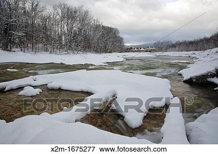 Stock Photo - East Branch of the Pemigewasset River in Lincoln, New Hampshire USA after a snow storm. Fotosearch