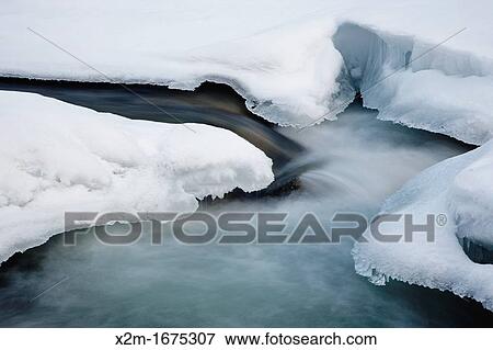 Stock Photo - East Branch of the Pemigewasset River in Lincoln, New Hampshire USA during the winter months. Fotosearch