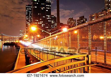 Picture - East River Drive aka FDR drive walkway path overlooking East River, Roosevelt Island, and Queensboro Bridge, Manhattan, New York City, USA. Fotosearch
