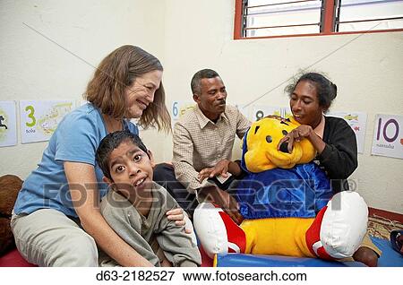 Stock Photo - East Timor. American Catholic missionaries working with people with special needs.. Fotosearch