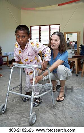Stock Photography - East Timor. American Catholic missionaries working with people with special needs.. Fotosearch