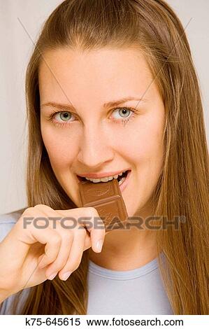 Eating chocolate View Large Photo Image Stock Photography - Eating chocolate. Fotosearch