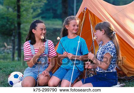 eating marshmallows at camp View Large Photo Image Stock Image - eating marshmallows at camp. Fotosearch