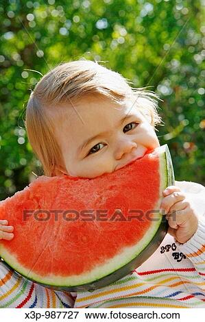 Stock Photo - Eating watermelon. Fotosearch
