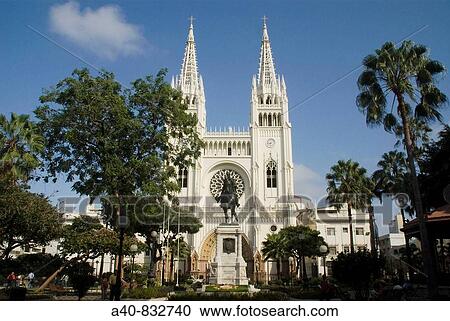 Stock Image - Ecuador. Guayaquil city. Metropolitan Cathedral ( 1924-37 ) and Seminario Park. Monument of Sim? n Bolivar.. Fotosearch