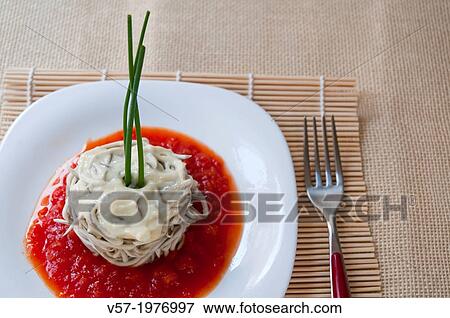 Eels with alioli on tomato sauce. View Large Photo Image Stock Photo - Eels with alioli on tomato sauce.. Fotosearch