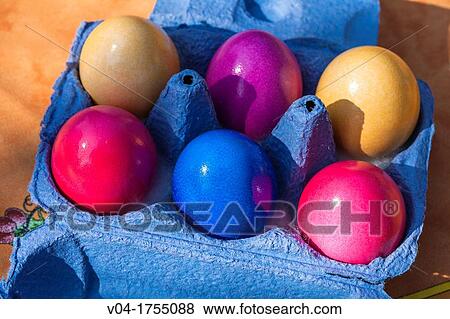Egg box filled with colorful easter eggs View Large Photo Image Stock Photo - Egg box filled with colorful easter eggs. Fotosearch