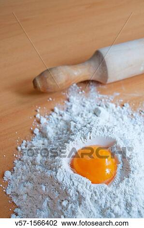 Egg yolk in flour View Large Photo Image Stock Image - Egg yolk in flour. Fotosearch